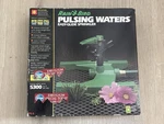 New Vintage Rain Bird Pulsing Waters Easy Glide Sprinkler Nib. Price: $49.99.