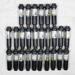 (26) Orbit 4" Pop-up Sprinkler Bodies With 15' Quarter Pattern Nozzles, 54344 Open. Price: $50.00.
