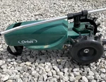 Orbit 58322 Traveling Sprinkler Green Tractor Cast Iron Garden Watering Sprayer Used. Price: $36.00.