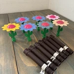 Lot Of 7 Melnor Decorative Daisy Sprinkler Tops - With Extenders (C9) Used. Price: $34.99.